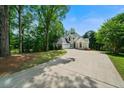 A beautiful two-story house is displayed with well-maintained landscaping and a long driveway at 2701 Gentry Dr, Douglasville, GA 30135