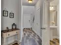 Elegant foyer featuring wood-look floors, neutral paint, and decor at 506 Tallapoosa Trl, Woodstock, GA 30188
