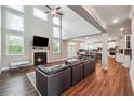 Spacious living room with fireplace, hardwood floors and open floor plan at 6375 Haystack Ct, Cumming, GA 30040