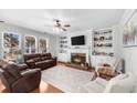Bright and airy living room featuring a fireplace, built-in shelving, and ample natural light at 100 Inspiration Ln, Dallas, GA 30157