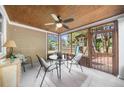 Cozy sunroom overlooking a backyard with a playset, perfect for relaxing and entertaining at 100 Inspiration Ln, Dallas, GA 30157