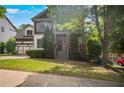 Beautiful two-story home with manicured lawn, mature trees, and a welcoming entrance in a serene neighborhood at 2584 Kickerillo Se Way, Atlanta, GA 30316