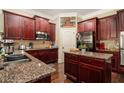 Well-equipped kitchen with granite countertops and stainless steel appliances at 108 Telfair Ln, Mcdonough, GA 30253