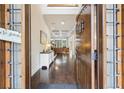 Inviting foyer with gleaming hardwood floors and a view of the coffered ceiling in the living room at 2652 Brickell Sq, Atlanta, GA 30341
