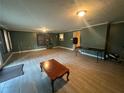 Spacious living room with neutral paint, light flooring, and plenty of room for entertaining at 661 Oak Dr, Riverdale, GA 30274