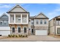 Charming two-story home with stone accents, a balcony, and a two-car garage nestled in a quiet neighborhood at 91 Batten Board Way, Woodstock, GA 30189