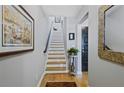 Inviting hallway with hardwood floors, staircase, and elegant decor at 1365 Memorial Se Dr # 12, Atlanta, GA 30317
