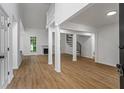 Bright living room with vaulted ceilings, fireplace, wood floors, and open floorplan to dining area at 1909 Riverlanding Cir, Lawrenceville, GA 30046