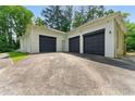 Detached garage with ample parking space and a well-maintained exterior at 4265 Hidden Valley Dr, South Fulton, GA 30349