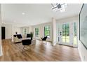 Bright living room with hardwood floors, large windows, and contemporary furniture at 4265 Hidden Valley Dr, South Fulton, GA 30349