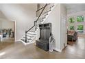 Welcoming foyer with hardwood floors, staircase, coat rack, and sunlit living area at 4365 Dover Crossing Dr, Marietta, GA 30066