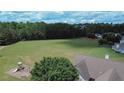 Large, grassy community park with play and sports areas, adjacent to residential homes at 1332 Kent Mnr, Stockbridge, GA 30281