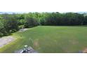 Expansive green community park features playground and soccer goals, surrounded by trees at 1332 Kent Mnr, Stockbridge, GA 30281