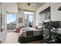 Bedroom with city views, hardwood floors, and a modern workspace at 860 Peachtree Ne St # 904, Atlanta, GA 30308