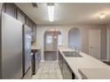 Modern kitchen with stainless steel appliances, dark wood cabinets, and an eat-in bar at 4045 Meadow Glen Way, Fairburn, GA 30213