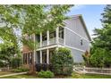 Charming two-story home showcasing a inviting front porch, and well-maintained landscaping at 3087 Dunton Se St, Smyrna, GA 30080