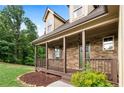 Close-up of the home's front porch showcasing its stone facade and inviting entryway at 42 Treemont Se Dr, Cartersville, GA 30121