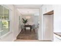 Elegant dining room with modern chandelier and views of a large window at 1398 Woodland Ave, Atlanta, GA 30316