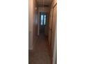 Hallway with neutral carpet and doors leading to rooms with natural light, enhancing the home's interior appeal at 3820 London Dr Dr, Decatur, GA 30032