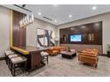 Modern lounge with comfortable seating, large wall-mounted TV, contemporary art, and bar height table at 855 Peachtree Ne St # 2713, Atlanta, GA 30308
