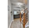 Inviting foyer with hardwood floors, a staircase with iron spindles and a view into the living room at 2895 Cross Creek Dr, Cumming, GA 30040