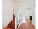 View of the home's staircase, that leads to the upper level near the kitchen at 3240 Corktree Trl, Stonecrest, GA 30038