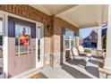 Inviting front porch with stone accents and comfortable seating, perfect for relaxation at 2225 Independence Ln, Buford, GA 30519