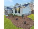 A well landscaped yard surrounds this lovely home with brick accents at 5331 Tuscany Dr, Douglasville, GA 30135