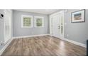 Bright living room with wood floors, white trim, and a modern, neutral color scheme at 581 Taylor Se Dr, Smyrna, GA 30080
