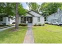 Charming brick home with a well-manicured lawn and inviting front porch at 2284 Dauphine St, East Point, GA 30344