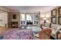 Bright living room with bay window, traditional furniture, and beautiful hardwood floors at 375 Spindle Ct, Sandy Springs, GA 30350