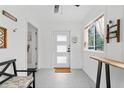 Bright entryway with a bench, light gray flooring, and natural light at 428 Tibbetts Se St, Marietta, GA 30060