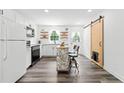 Modern kitchen featuring white cabinets, stainless appliances, and an island with seating at 428 Tibbetts Se St, Marietta, GA 30060