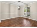 Neutral dining area filled with natural light and hardwood flooring at 95 Ivy Ne Trl, Atlanta, GA 30342