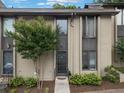 Contemporary townhouse showcasing well-maintained landscaping and a welcoming entrance at 95 Ivy Ne Trl, Atlanta, GA 30342