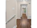 Hallway with hardwood floors leading to bright room with window at 95 Ivy Ne Trl, Atlanta, GA 30342