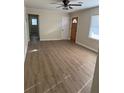 Living room featuring wood-look floors and updated lighting at 3133 Rebecca St, Covington, GA 30014