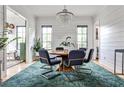 Elegant dining area with modern chandelier, stylish decor, and plenty of natural light at 797 Greenwood Ne Ave, Atlanta, GA 30306