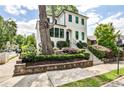 Charming home featuring well-maintained landscaping and a classic white exterior at 797 Greenwood Ne Ave, Atlanta, GA 30306