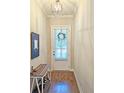 Inviting entryway featuring hardwood floors and a decorative wreath on the front door at 2128 Sonoma Se Dr, Smyrna, GA 30080