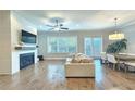Cozy living room featuring a fireplace and large windows for ample natural light at 2128 Sonoma Se Dr, Smyrna, GA 30080