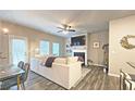 Comfortable living room with a fireplace, ceiling fan, and large sofa at 3401 Endurance Ct # 10, Atlanta, GA 30349