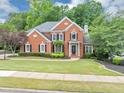 Beautiful two-story brick home features a well-maintained lawn and inviting curb appeal at 3722 Somerset Nw Rdg, Kennesaw, GA 30144