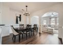 Elegant dining room featuring dark wood floors, stylish lighting, and serene decor at 3901 High Dove Sw Way # 17, Smyrna, GA 30082
