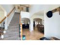 Spacious foyer with a staircase, hardwood floors, and an open layout to the dining area at 1657 Millhouse Lndg, Marietta, GA 30066