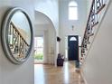 Inviting foyer with hardwood floors, staircase with wrought iron, and high ceilings at 1657 Millhouse Lndg, Marietta, GA 30066