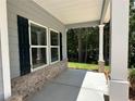 Cozy covered front porch featuring classic columns and a view of the landscaped yard at 19 Loth Wages (Lot 19) Rd, Dacula, GA 30019
