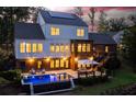 Stunning backyard oasis with a pool, patio, and outdoor seating area, perfect for entertaining at 225 Blueberry Rdg, Milton, GA 30075