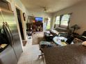 A comfortable living room with natural light, a ceiling fan, and neutral walls at 2539 Dogwood Hills Ct, Austell, GA 30106