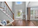 Welcoming foyer with hardwood floors, staircase and view to the outside at 44 Kingsford Xing, Acworth, GA 30101